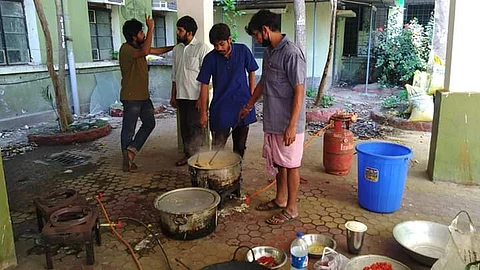 The students cooking at the community kitchen (Pic: AFSU)