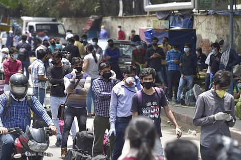 People waiting to enter New Delhi railway station (Pic: PTI)