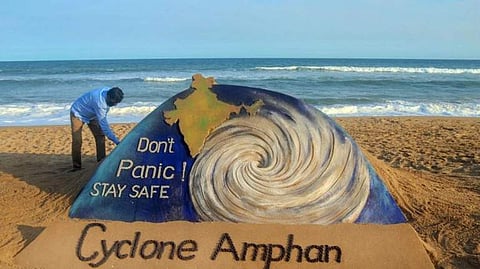 Sand artist Sudarshan Patnaik creates sculpture of Cyclone Amphan to urge people to stay safe and keep calm (Pic: PTI)