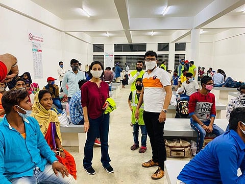 Migrant workers along with volunteers waiting at the airport (Pic: Facebook)