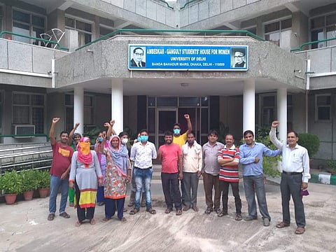 The workers outside the hostel (Pic: Sourced)