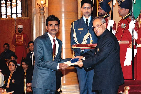 Azam receiving the award from former president Pranab Mukherjee | (Pic: Mohammad Azam)