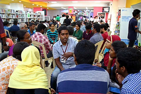 At a typical Human Library event, people gather around and talk to the 'book' |Pic: Romani Agarwal