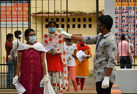 Students undergo thermal scan at a NEET centre (Pic: TNIE)
