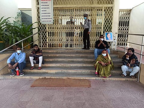 Surya's family outside the administration office