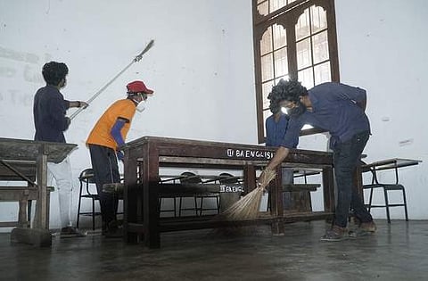 With regular classes resuming on Monday, students of University College in Thiruvananthapuram clean the classrooms on Sunday. | Pic: Express, B P Deepu