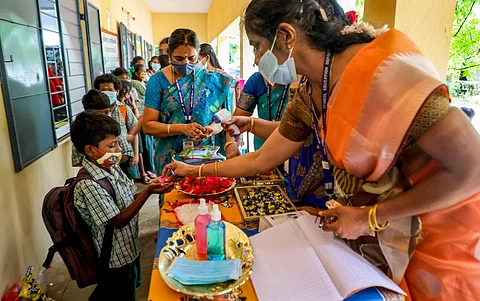 A student welcomed with sweets at a school in Chennai | Pic: PTI