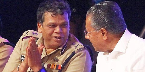 DGP Loknath Behera wth Kerala Chief Minister (Pic: Express)