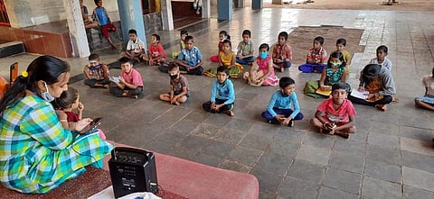 Children gather in one of the places to listen to Katha Kalarava programme on radio (Pictures: Early Spark Foundation)