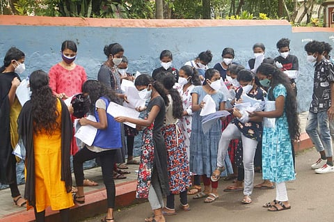 Students from Wayanad engage in discussion after appearing for CLAT test at St Joseph's College Devagiri in Kozhikode on Friday | Express Photo by TP Sooraj