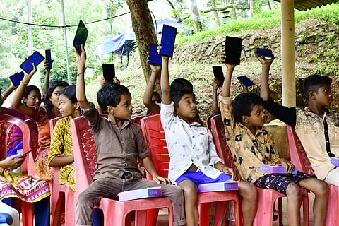 The tribal kids with their tablets | Pic courtesy: V Ummer Koya