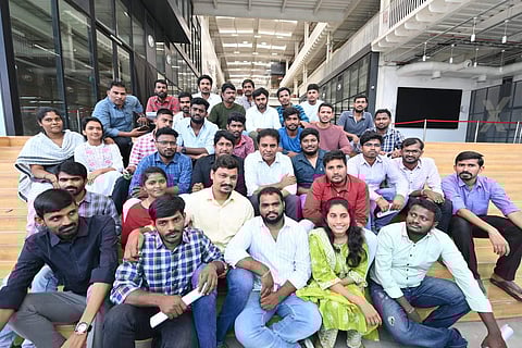A picture of Telangana Minister KTR with government job aspirants from Ashok Nagar.