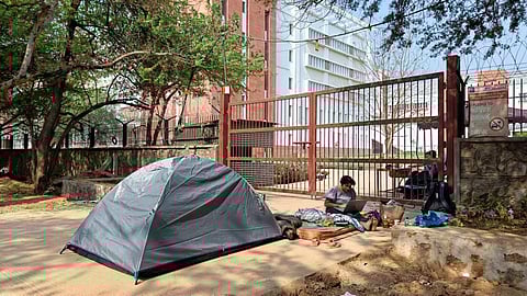 SAU student camps outside main gate after eviction from hostel | (Pic: Apoorva YK)
