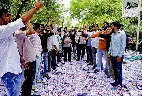 Students raise slogans at the College Of Vocational Studies during Delhi University Students' Union (DUSU) polls, in New Delhi. (PTI Photo)