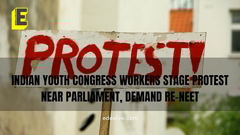The protesters were carrying a large banner that said "RE-NEET". 