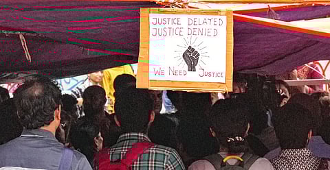 Poster at the protest site near Swasthya Bhawan