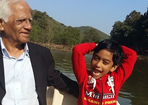 A young Tarun out and about with his grandfather on a Children's Day gone by