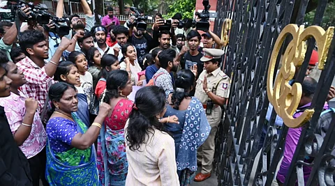 Students protest in front of Anna University gate 