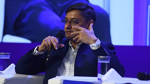 Economist and member of the Economic Advisory Council to the Prime Minister, Sanjeev Sanyal (L), speaks at the Think Edu Conclave in Chennai on January 28, 2022.