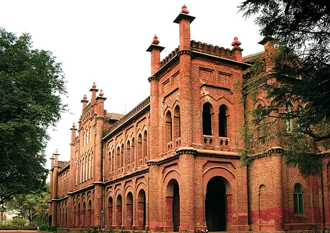 Why was American College Madurai principal suspended one day before his retirement?