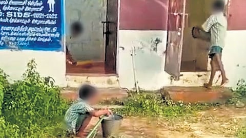 Students cleaning toilets at a primary school in Pudukkottai