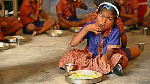 Students are seen eating lunch in a government school in Chennai