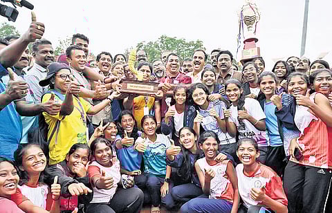 Thiruvananthapuram team celebrating with the Chief Minister’s Cup in the State School Sports Meet at University Stadium in Thiruvananthapuram on Tuesday.