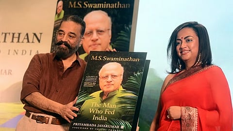 MP Kamal Haasan releasing the book ‘The Man Who Fed India’ with author Priyambada Jayakumar.