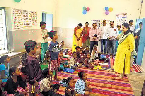 Collector Pamela Satpathy on Thursday interacts with children of brick kiln workers at Gattubuthkur government school in Karimnagar district