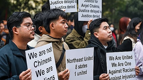 North East students union members hold placards during a protest against the killing of Tripura student AnJel Chakma , at Jantar Mantar in New Delhi, Wednesday, Dec. 31, 2025.