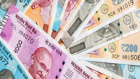 Rupee slips 4 paise to 90.21 against dollar 