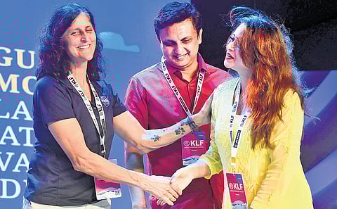 Actor Bhavana greets former astronaut Sunita Williams at the opening ceremony of the Kerala Literature Fest in Kozhikode on Thursday. Tourism and Works Minister P A Mohamed Riyas looks on 
