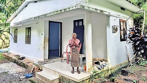 Chakki Amma in front of her house in Mavoor, Kozhikode