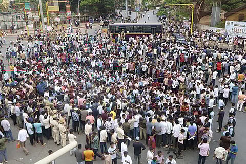 A massive protest erupted in Dharwad on Tuesday as government job aspirants took to the streets.