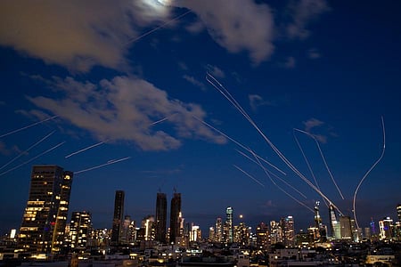 Missiles light up the night sky as conflict escalates