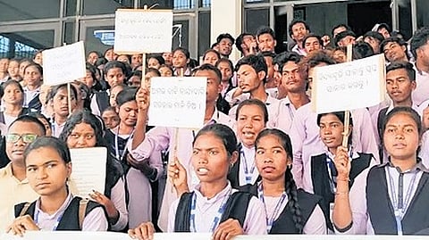 Students staging protest in front of Gajapati collector’s office on Thursday.