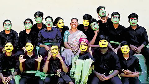 Students of Kalveerampalayam Government Higher Secondary School, who perform street plays on social issues, along with teacher Sasikala