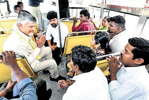 Chief Minister N Chandrababu Naidu interacts with specially abled persons while travelling in APSRTC bus in Mangalagiri on Wednesday.
