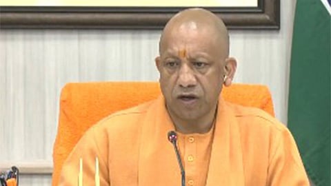 CM Yogi Adityanath after handing over land allotment letters