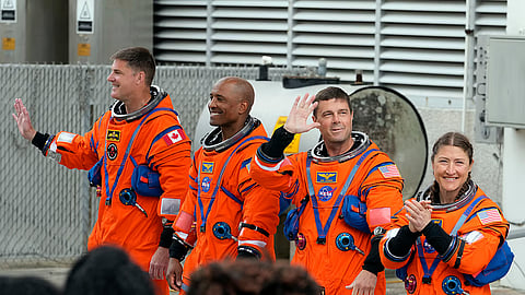 Astronauts , from left, Mission Specialist Jeremy Hansen, of Canada, Pilot Victor Glover, Commander Reid Wiseman and Mission Specialist Christina Koch leave the Operations and Checkout Building for a trip to Launch Pad 39-B and a planned liftoff on NASA's Artemis II moon rocket at the Kennedy Space Center Wednesday, April 1, 2026, in Cape Canaveral, Fla.