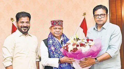 Chief Minister A Revanth Reddy and IT & Industries Minister D Sridhar Babu greet Governor Shiv Pratap Shukla at Lok Bhavan in Hyderabad on Sunday