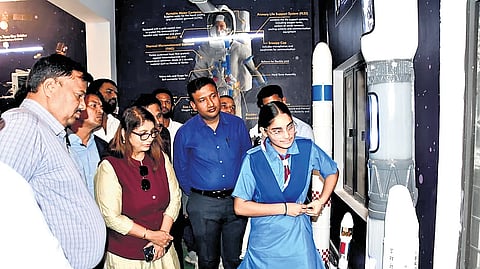 Officials go through the exhibits at the ‘Astronomy and Space Laboratory’ at the Kasturba Gandhi Balika Vidyalaya (KGBV) in Bangariguda