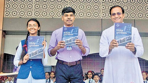 ‘Easy Accounts’ book being released by Fr John Joseph Vadakkel CST, principal of Little Flower School, Harayya, Uttar Pradesh. The author Santu P A is also seen