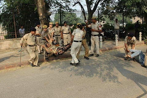 Najeeb Ahmed's mother was dragged by her hair and shoved into a police vehicle on October 18 | Pic courtesy: Umar Khalid