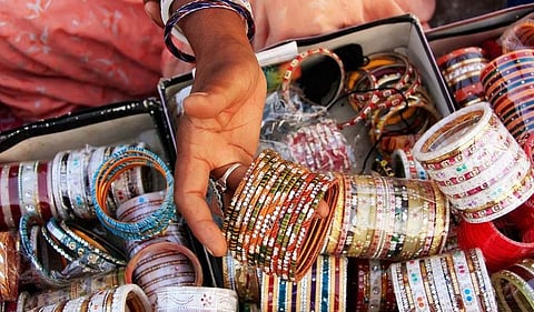A child selling a bangle or toy would naturally trigger a sense of sympathy among passers-by