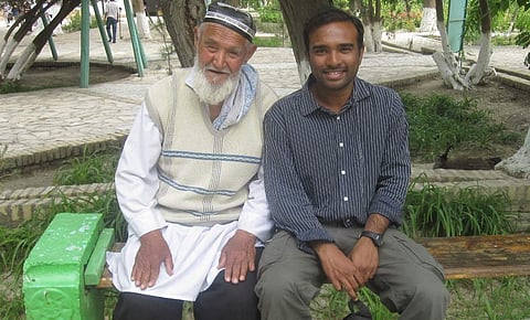 Reddy chatting with an old man at Bukhara, Uzbekistan, while on the Silk Route