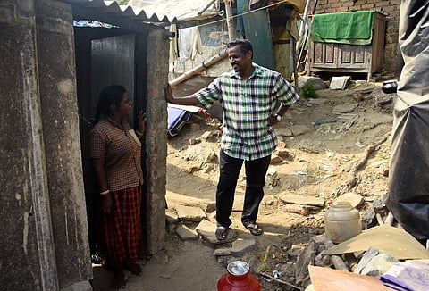 Joshua Jayaseelan is seen talking to a woman from the Appasamy Street slum. This professor from MCC is dedicated to the cause of upliftment of these slum dwellers | Pics: Ashwin Prasath