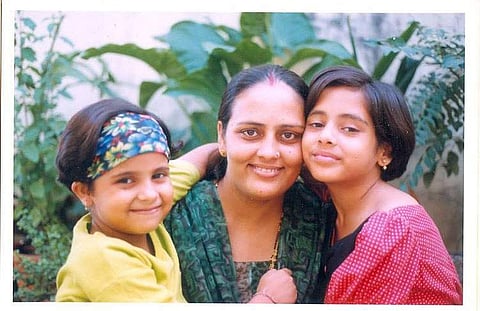 Neha and Diksha Dwivedi with their mother during their childhood