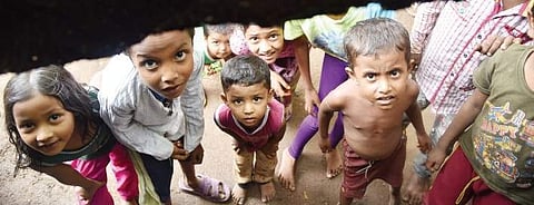 Oblivious to all this sadness and worry are the children who have bright smiles on their faces