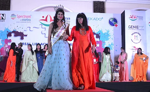 The models wore a range of creativce and artsy designs from crop tops to lehengas and Kurtas. Pictured: A survivor with a model